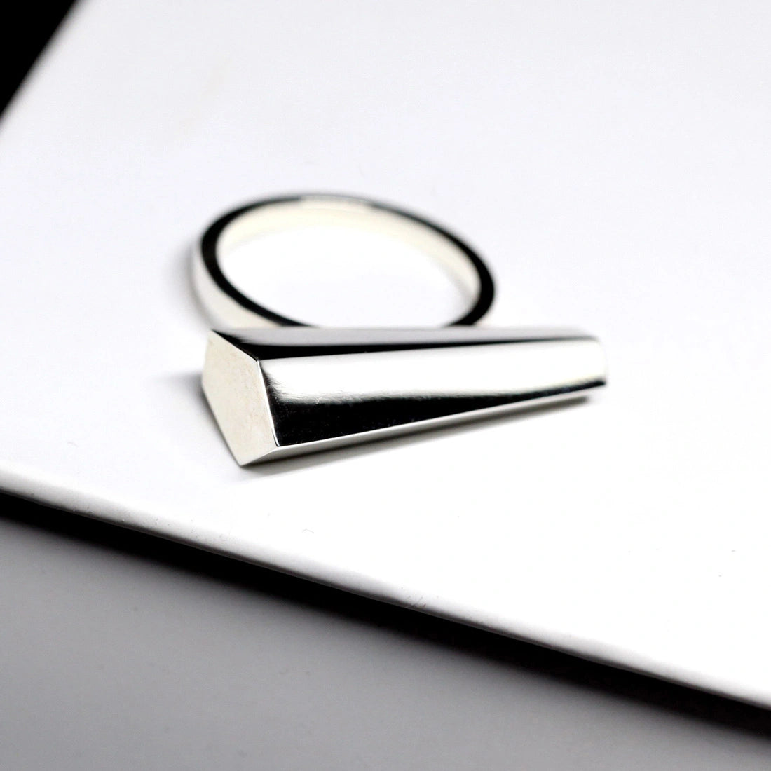 Sturdy ring in white gold photographed on a white background. A Minimalist, modern and elegant piece of jewelry. Find this gender-neutral ring that fits both classic and edgy wardrobes online or at our Montreal jewelry store.