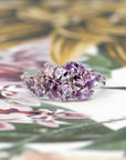 Close-up: Focuses on the sapphires’ natural brilliance and the refined craftsmanship of the yellow gold band. Custom jewelry by Bena Jewelry, Montreal, Canada.
