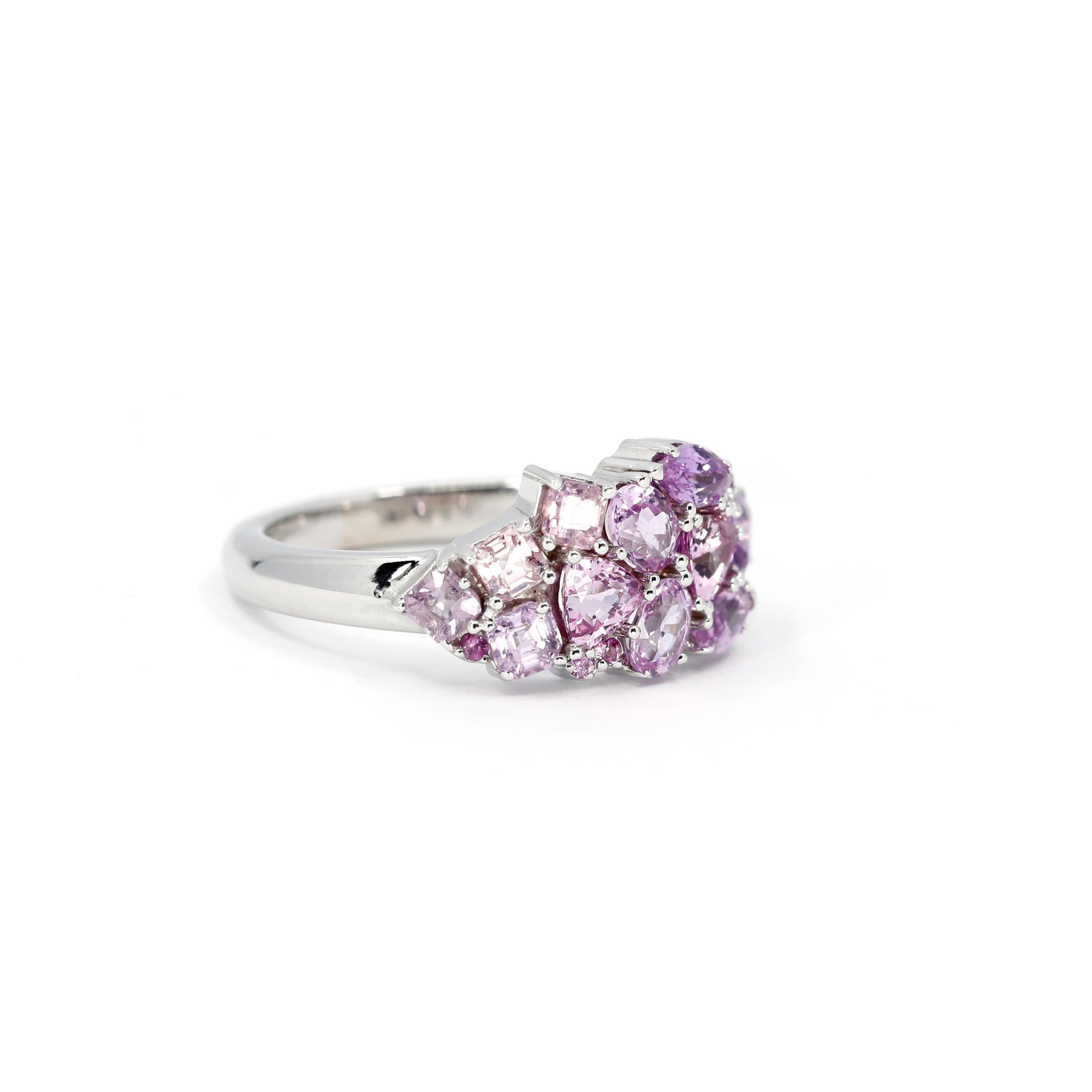 Close-up: Captures the intricate placement of the natural sapphires and their soft lilac hues, framed by the sleek yellow gold. Custom-made by Bena Jewelry, Montreal, Canada.