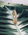 Close-up of the classic 14K yellow gold wedding band, highlighting the stunning sparkle of its 1.50 mm diamonds. A perfect view of the exceptional clarity and brilliance in every detail.