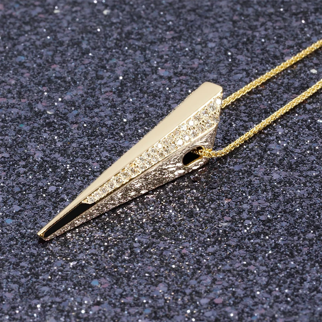 Diamond Pike Pendant in yellow gold with sparkling diamonds, showcased on a dark glittery background, designed by Bena Jewelry in Montreal.