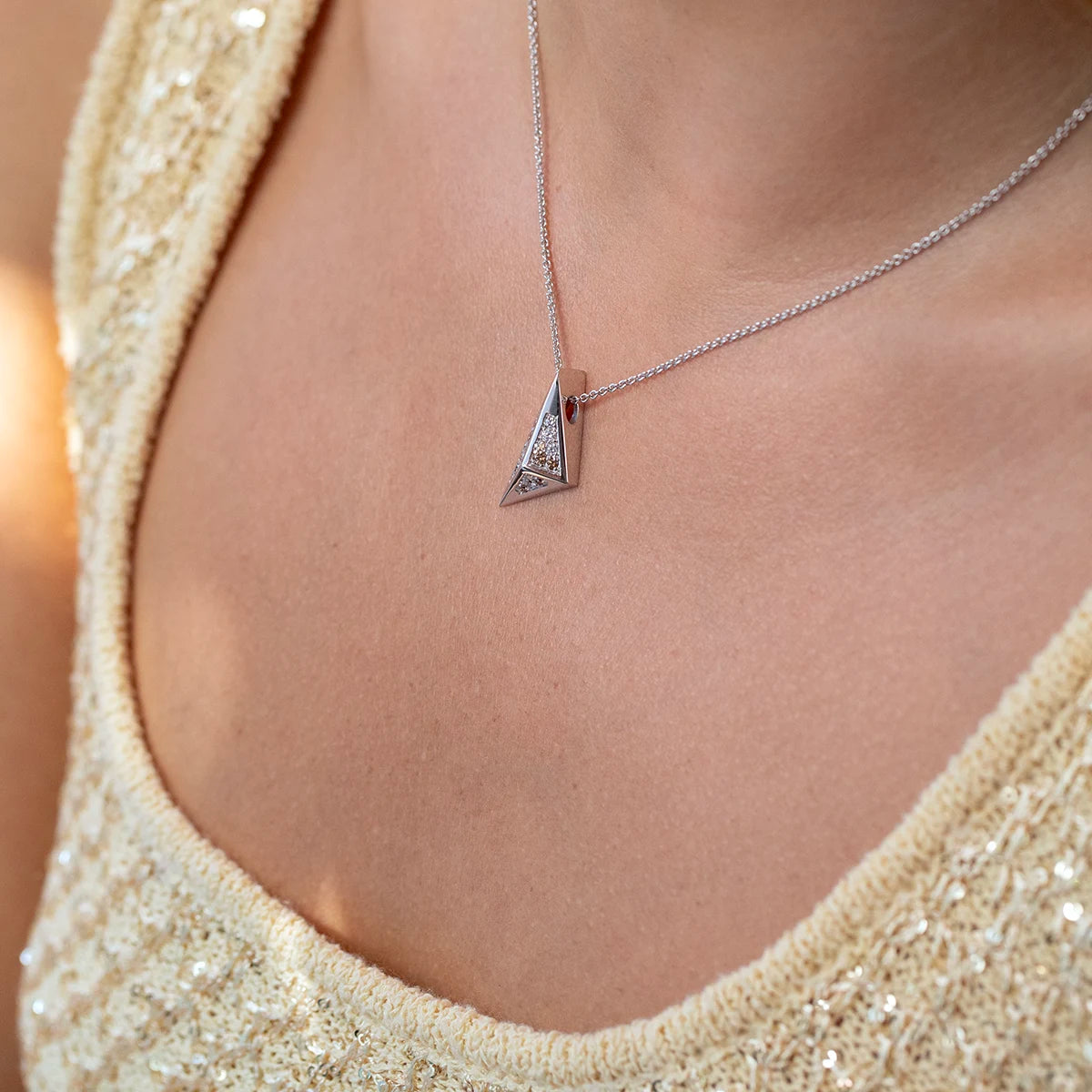 Bena Jewelry Diamond Pyramid Pendant in 14k white gold, a striking unisex necklace with sharp geometric angles, set with white and golden-brown diamonds for a bold, architectural statement look.