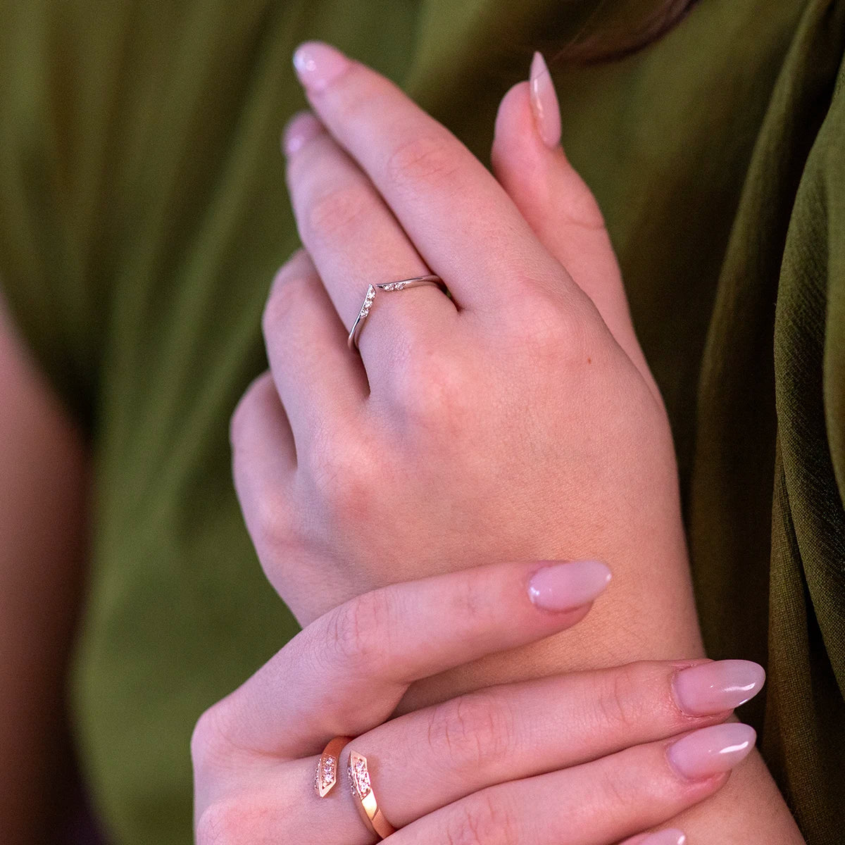 Modern Kink open diamond ring in white gold on a vibrant background, featuring brilliant natural diamonds and crafted by Bena Jewelry in Montreal, Canada.
