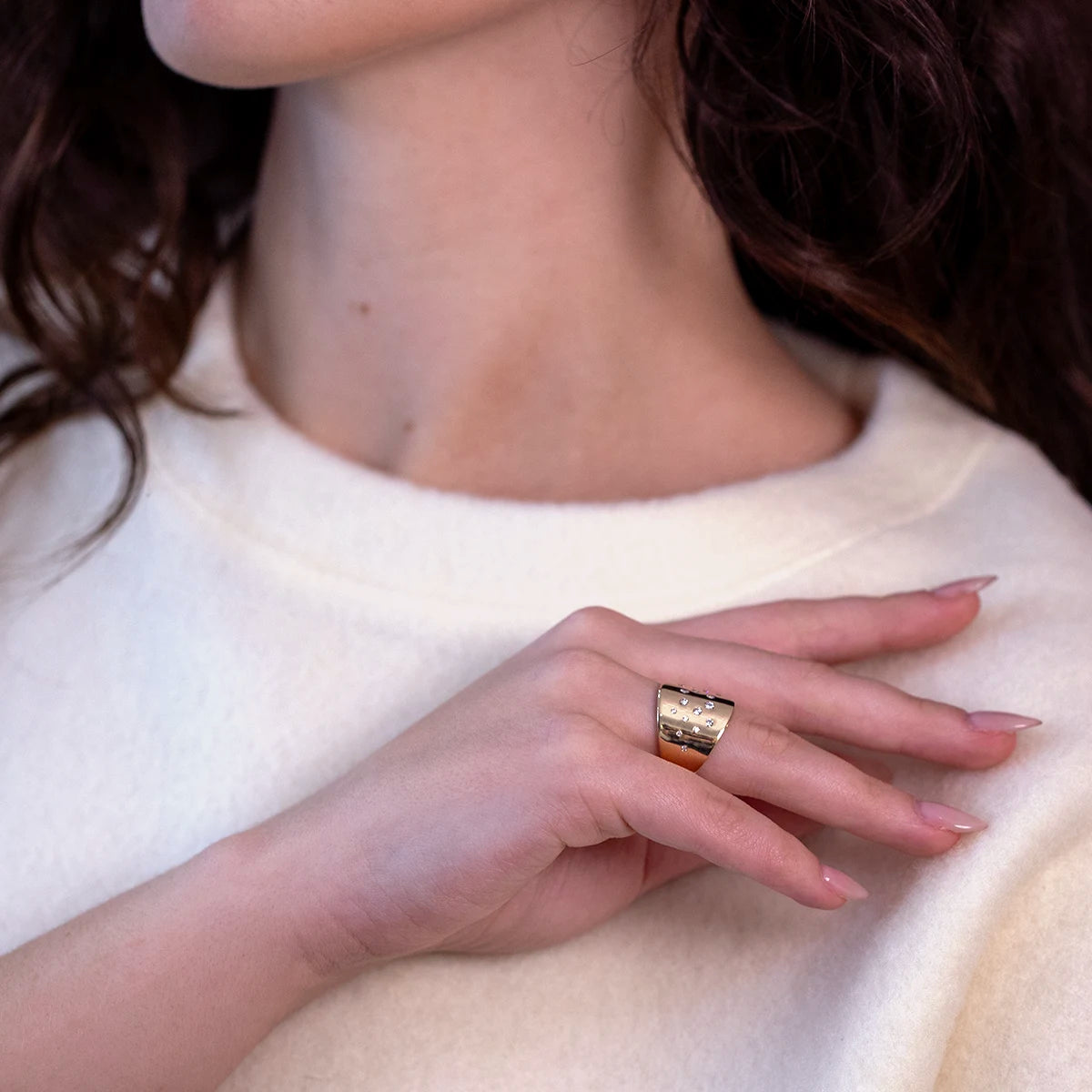 Bold yellow gold and diamond statement ring, styled on a woman, crafted by independent designer Bena Jewelry in Montreal.