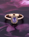 Bena Jewelry purple sapphire halo ring in rose gold with natural champagne diamonds. Contemporary engagement ring alternative designed and made in Montreal.