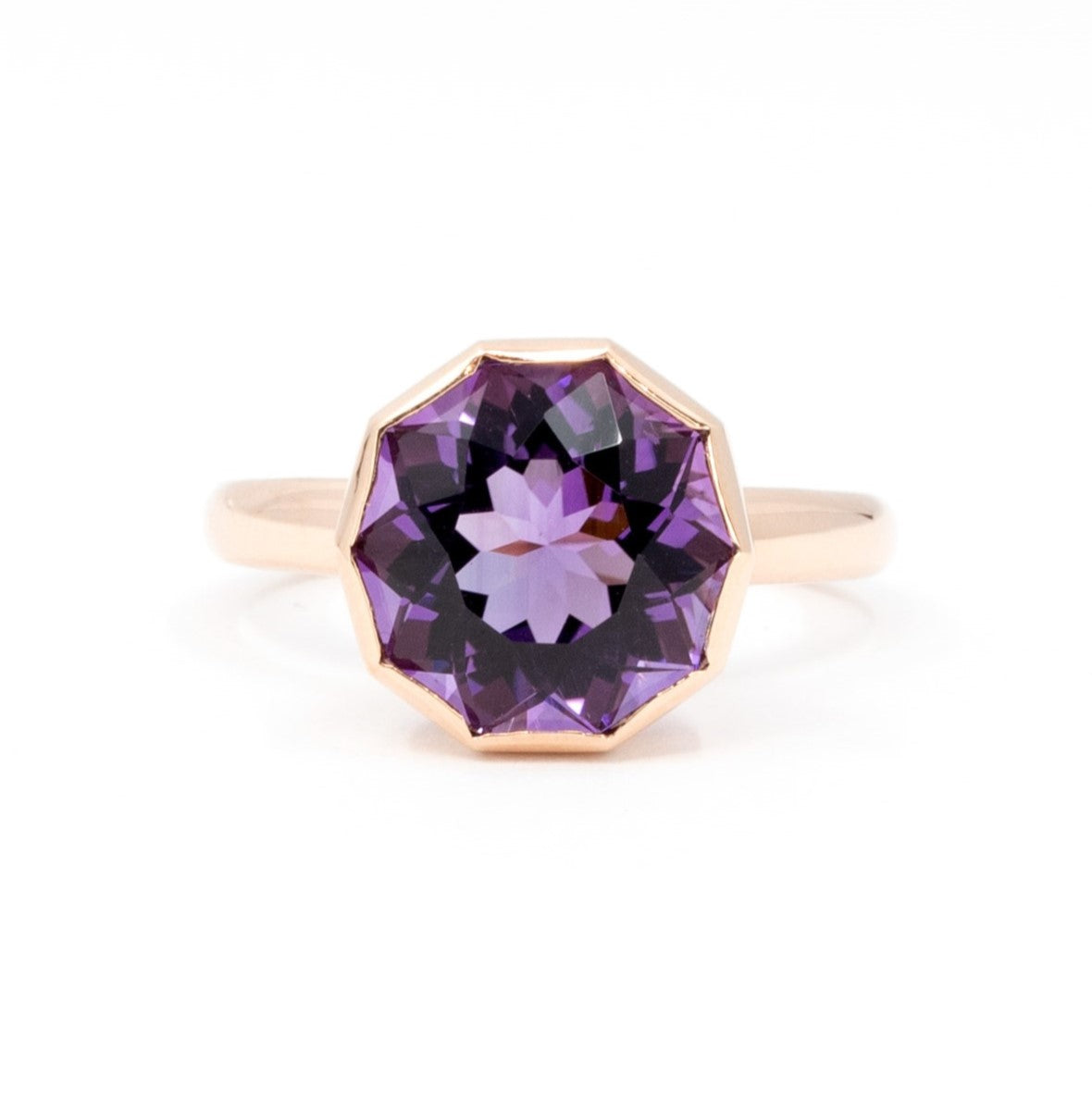 Front view of Bijou Round Fancy Amethyst Ring with a deep violet round amethyst, bezel-set in yellow gold, displayed on a white background.