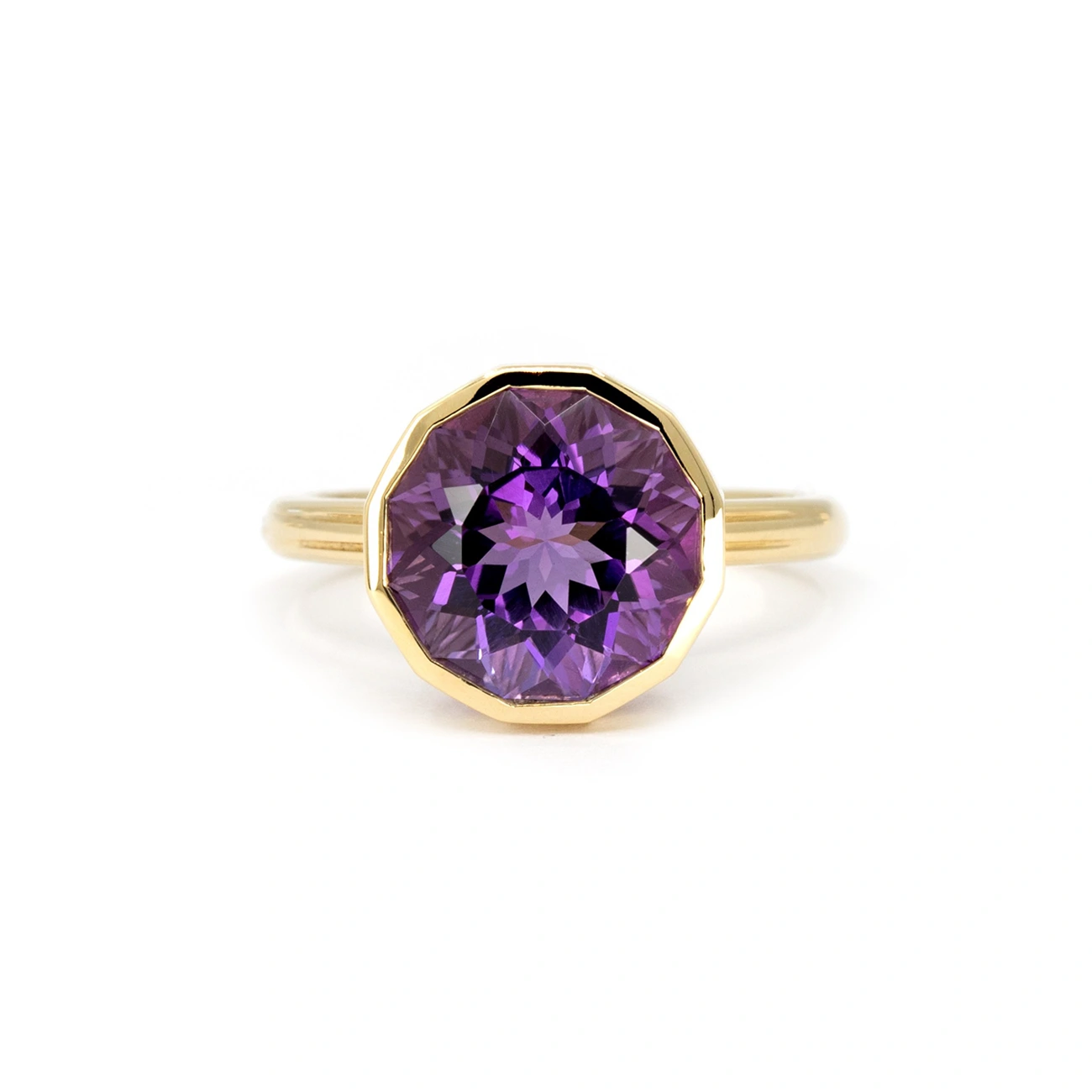 Front view of a bold yellow gold amethyst cocktail ring by Bena Jewelry, featuring a stunning fancy-shaped amethyst with deep purple hues, designed for a statement look.