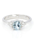 Top view: Showcasing the sky-blue aquamarine centerpiece and the brilliance of the side diamonds set in white gold. Designed by Bena Jewelry, crafted in Montreal, Canada.