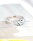 Side angle: Highlights the aquamarine's delicate blue hue and the sleek white gold setting. A bespoke creation by Bena Jewelry in Montreal, Canada.