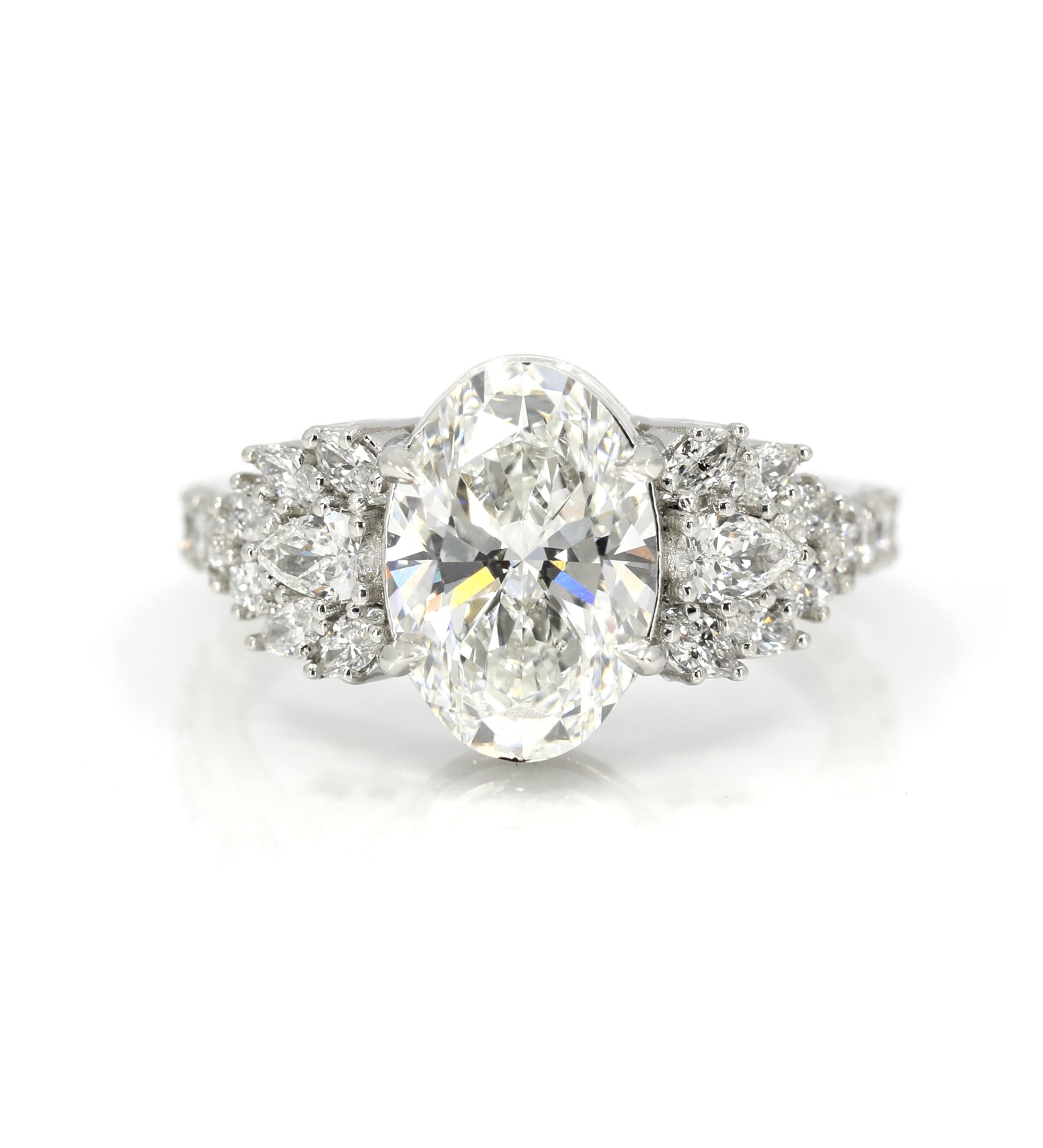 designer engagement ring lab grown diamonds oval shape marquise pear natural top icy diamonds designer bena jewelry montreal custom made by boutique ruby mardi best jeweler in canada on white background