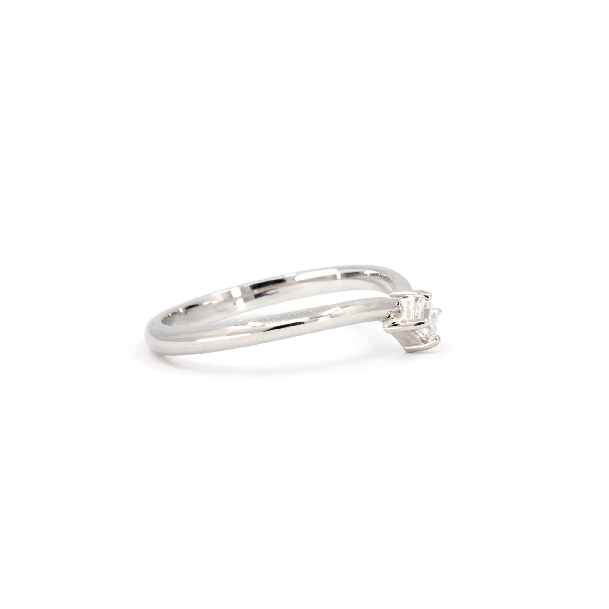 Side view of the minimalist white gold ring with a bold Asscher-cut diamond, elegantly designed with a slight curve made in Montreal by Bena Jewelry.