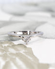 Close-up view of Asscher-cut diamond set in white gold, highlighting the intricate cut and geometric brilliance, crafted by Bena Jewelry designer.
