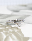 Side view of the edgy white gold ring with Asscher-cut diamond made by Bena Jewelry, showcasing the gentle curve and bold design elements.