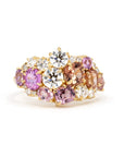 Front view: The Avalanche Peach & Pink Ring showcasing its artistic arrangement of peach and pink gemstones with diamonds in a polished yellow gold setting. Designed by Bena Jewelry in Montreal, Canada.