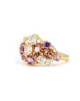 Close-up: Focuses on the vibrant peach and pink gemstone tones and the sparkle of the diamonds against the yellow gold. Made by Bena Jewelry, Montreal, Canada.