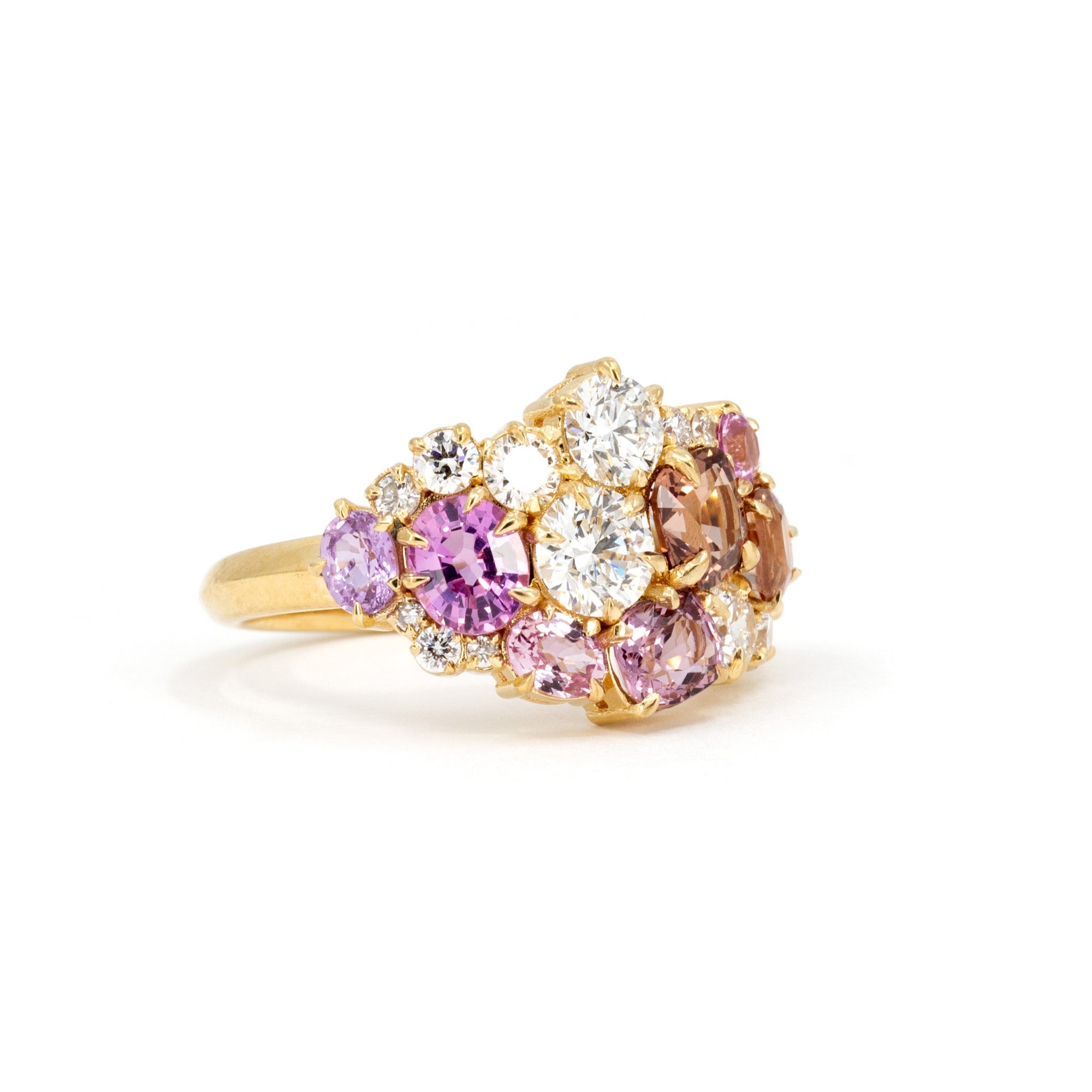 Displays the unique arrangement of the gemstones and their seamless integration with the yellow gold band. Crafted by Bena Jewelry, Montreal, Canada.