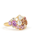 Displays the unique arrangement of the gemstones and their seamless integration with the yellow gold band. Crafted by Bena Jewelry, Montreal, Canada.