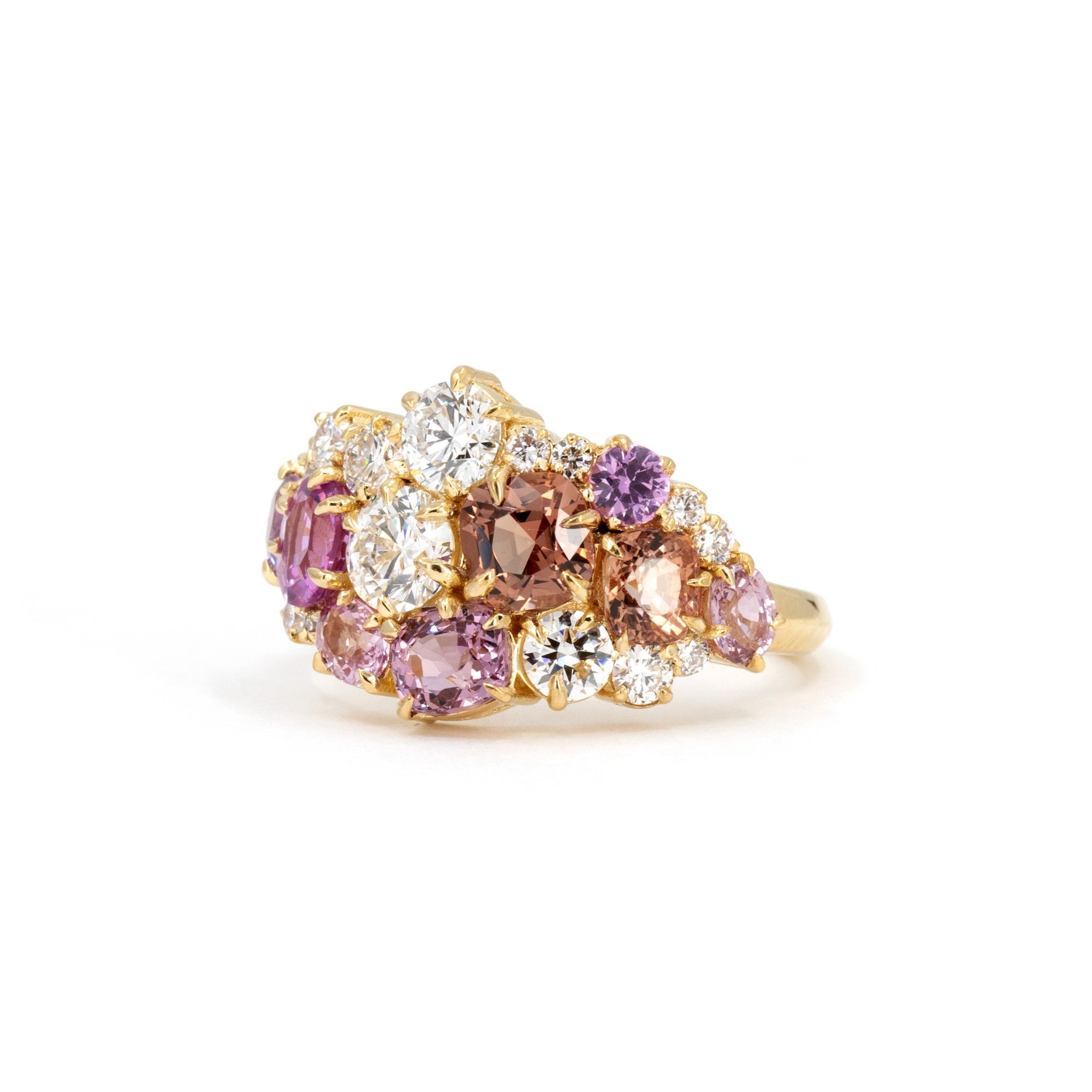 Highlights the dynamic arrangement of peach and pink gemstones with diamonds, set in yellow gold. Custom jewelry by Bena Jewelry, Montreal, Canada.