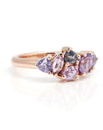 Close-up of the "Avalanche" ring in rose gold with lilac and purple sapphires, showcasing the fine craftsmanship and elegant design. Fine jewelry made in Montreal by Bena Jewelry, presented on a minimalist white background.
