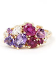 The Avalanche Purple Sapphire & Rubis Ring, featuring a pear-shaped violet sapphire and pink and red rubies, set in polished yellow gold. Designed by Bena Jewelry in Montreal, Canada.