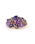 Front view: The Avalanche Deep Purple Ring showcasing its artistic arrangement of deep purple sapphires in yellow gold. Designed by Bena Jewelry in Montreal, Canada.