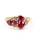 The Avalanche Purple Sapphire & Rubis Ring, featuring a pear-shaped violet sapphire and pink and red rubies, set in polished yellow gold. Designed by Bena Jewelry in Montreal, Canada.