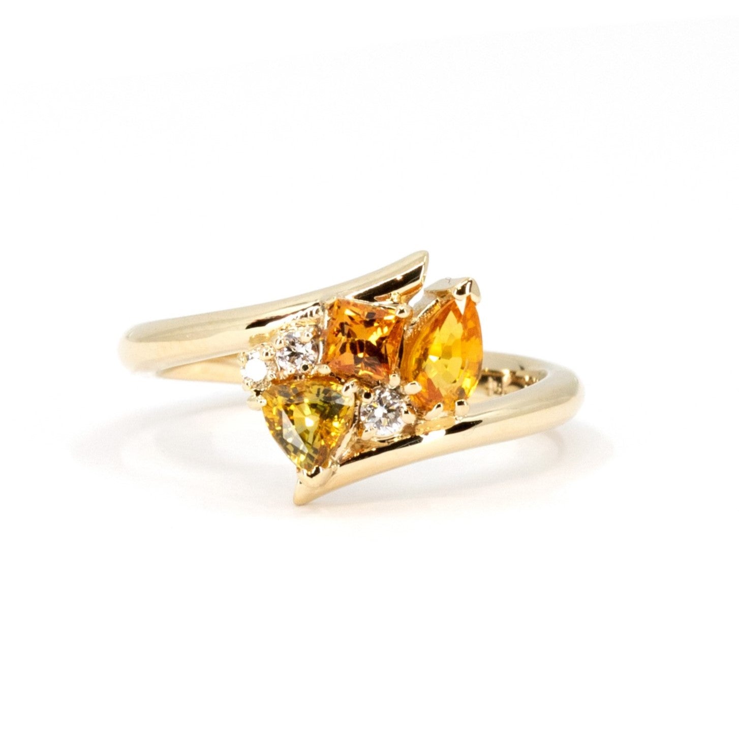 Kink Avalanche ring by Bena Jewelry featuring orange and yellow sapphires with diamonds in yellow gold, handcrafted in Montreal.