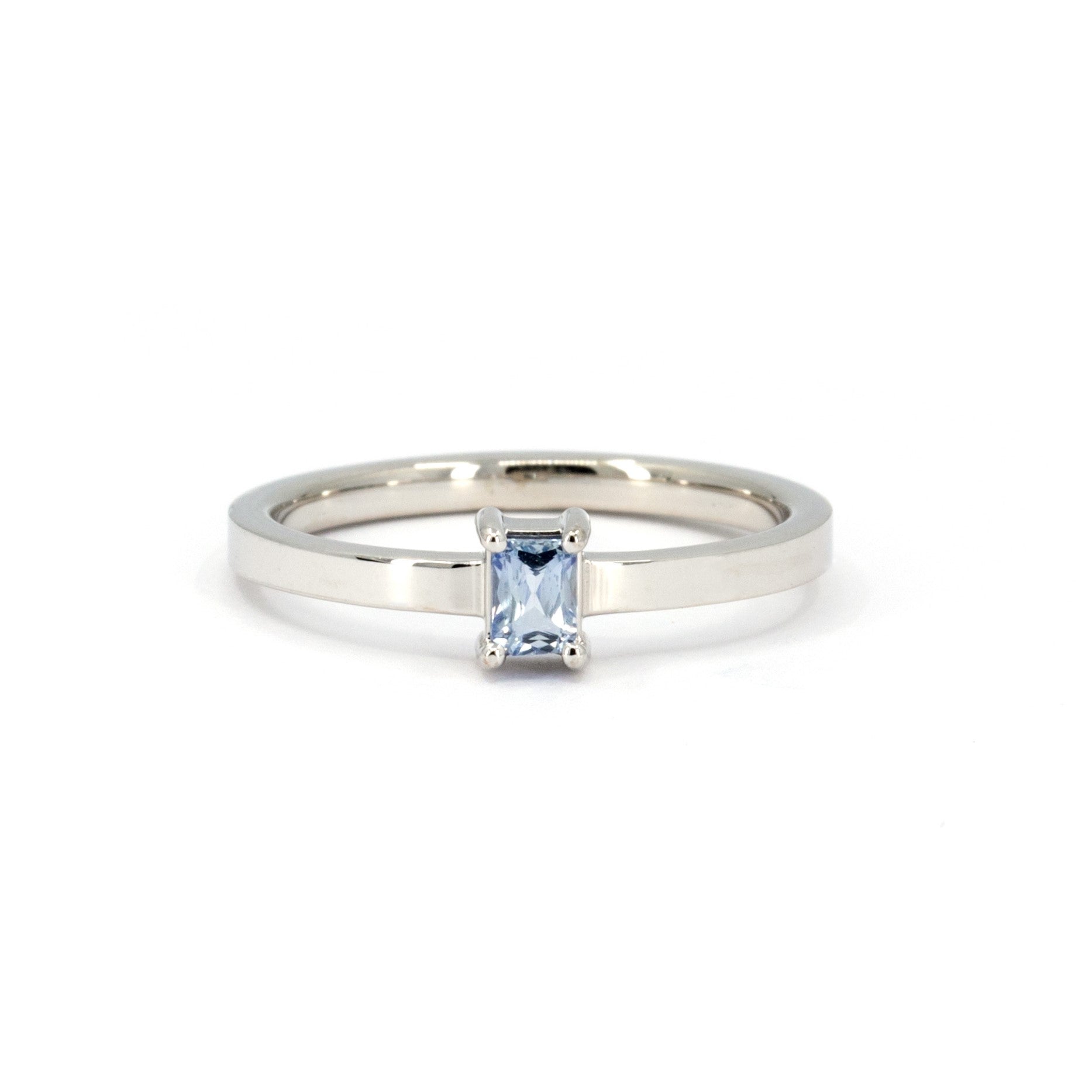 Sapphire baguette ring by Bena Jewelry, minimalist boxy design, handcrafted in Montreal with a striking blue sapphire centerpiece.