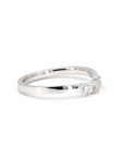 Close-up of the curved diamond band by Bena Jewelry, highlighting the three sparkling diamonds set in a refined, elegant curve.