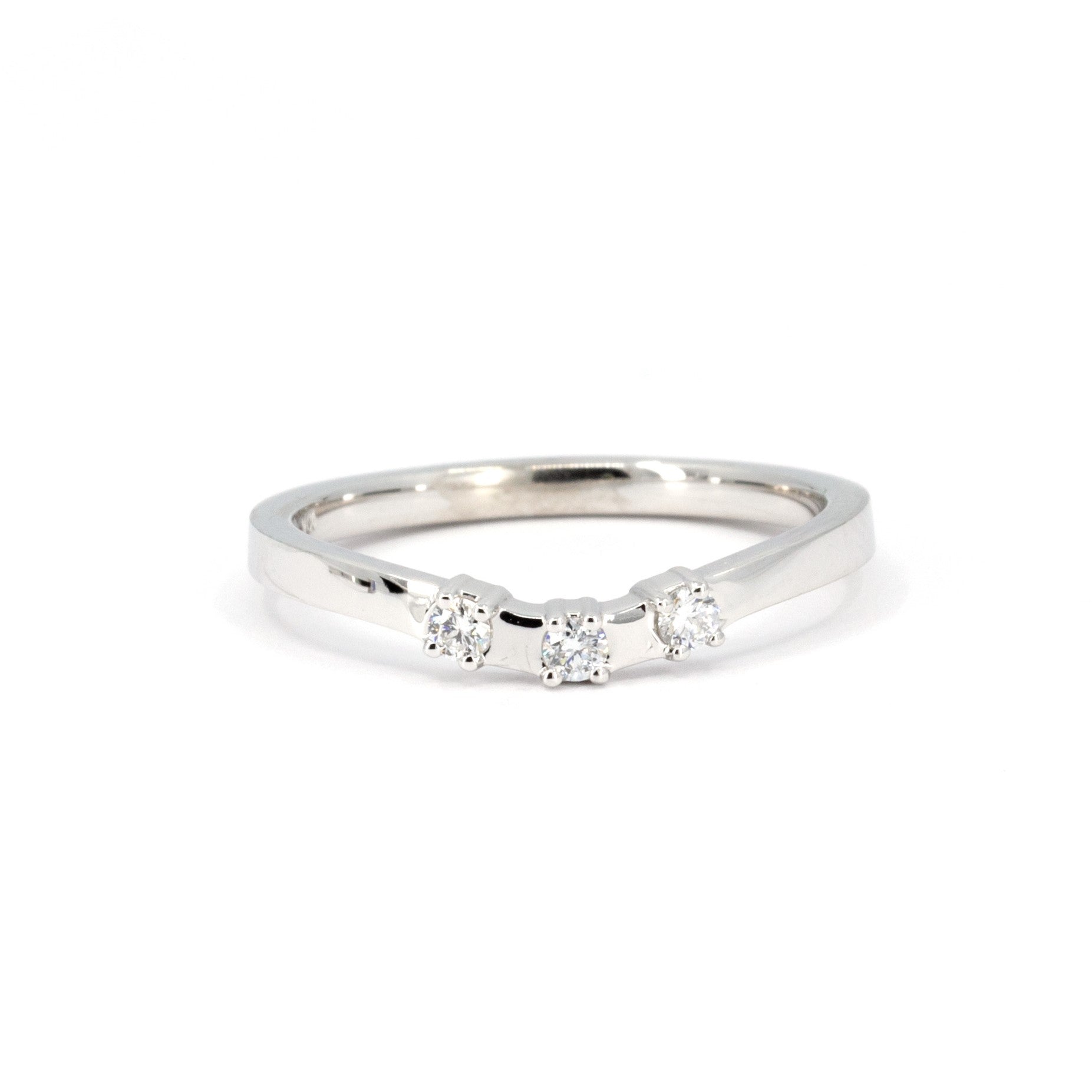 Curved diamond band by Bena Jewelry, featuring three small diamonds in a sleek minimalist design, handcrafted in Montreal.