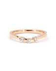 Detailed view of Bena Jewelry's rose gold diamond band, complementing the orange sapphire ring, on a white background.