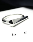 Close-up of Spine Ring in White Gold – A minimalist yet daring ring with a sharp, elongated structure.