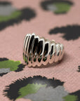 Pigalle Ring in White Gold on white background – A bold unisex gold ring with a sculptural ridged texture, handcrafted by Bena Jewelry in Montreal.