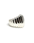 Close-up of Pigalle Ring in White Gold – A statement dome ring with deep grooves and a high-polish finish, blending modernity and bold design.