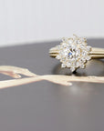 Close-up of the yellow gold diamond halo engagement ring, showcasing its luxurious design and brilliant sparkle.