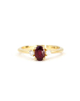 Ruby Flame Ring on white background – A classic engagement ring featuring an oval ruby and diamond accents in yellow gold. Handmade by Bena Jewelry in Montreal.