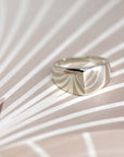 Lump Ring in White Gold on white background – A minimalist unisex ring with an symmetrical design, handcrafted by Bena Jewelry in Montreal.