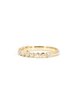 Elegant yellow gold wedding ring with a bezel-set diamond placed on a white background. Made-to-measure bridal jewelry by Bena Jewelry in Montreal.
