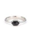 Custom-made ring featuring a hexagonal black diamond in a sleek bezel setting, crafted in white gold by Bena Jewelry, a designer jeweler from Montreal, Canada.