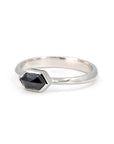 Unique white gold ring with a hexagonal black diamond, custom-designed by Bena Jewelry, highlighting fine craftsmanship and modern design from Canada.