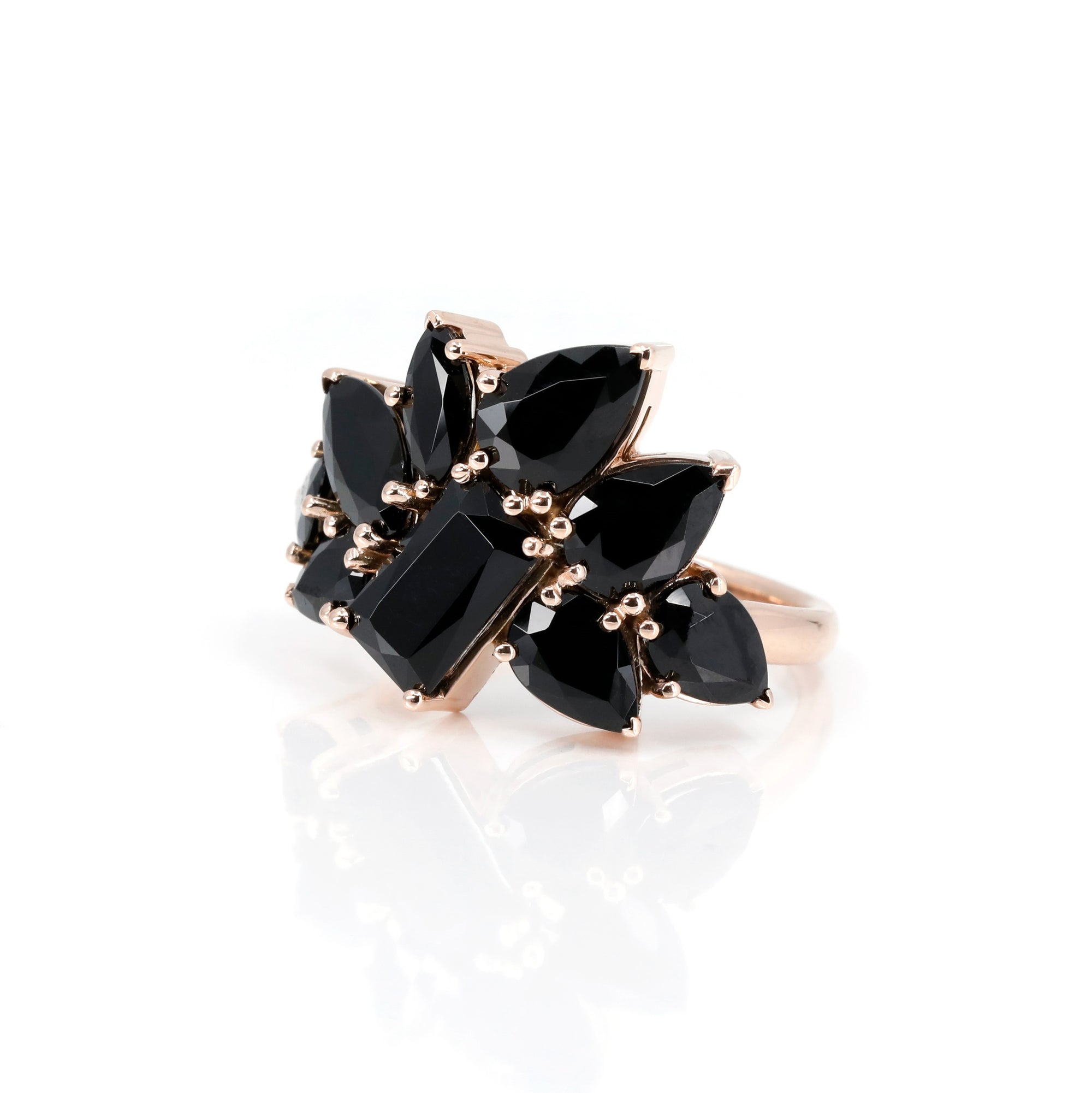Side profile emphasizing the artistic and random setting of the gemstones and the smooth finish of the rose gold. Fine designer jewelry made in Canada, by Bena Jewelry.