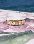 Full view of a bold yellow gold full eternity wedding band with a mix of marquise and round lab-grown diamonds totaling 1.82 carats made by Bena Jewelry in Montreal.