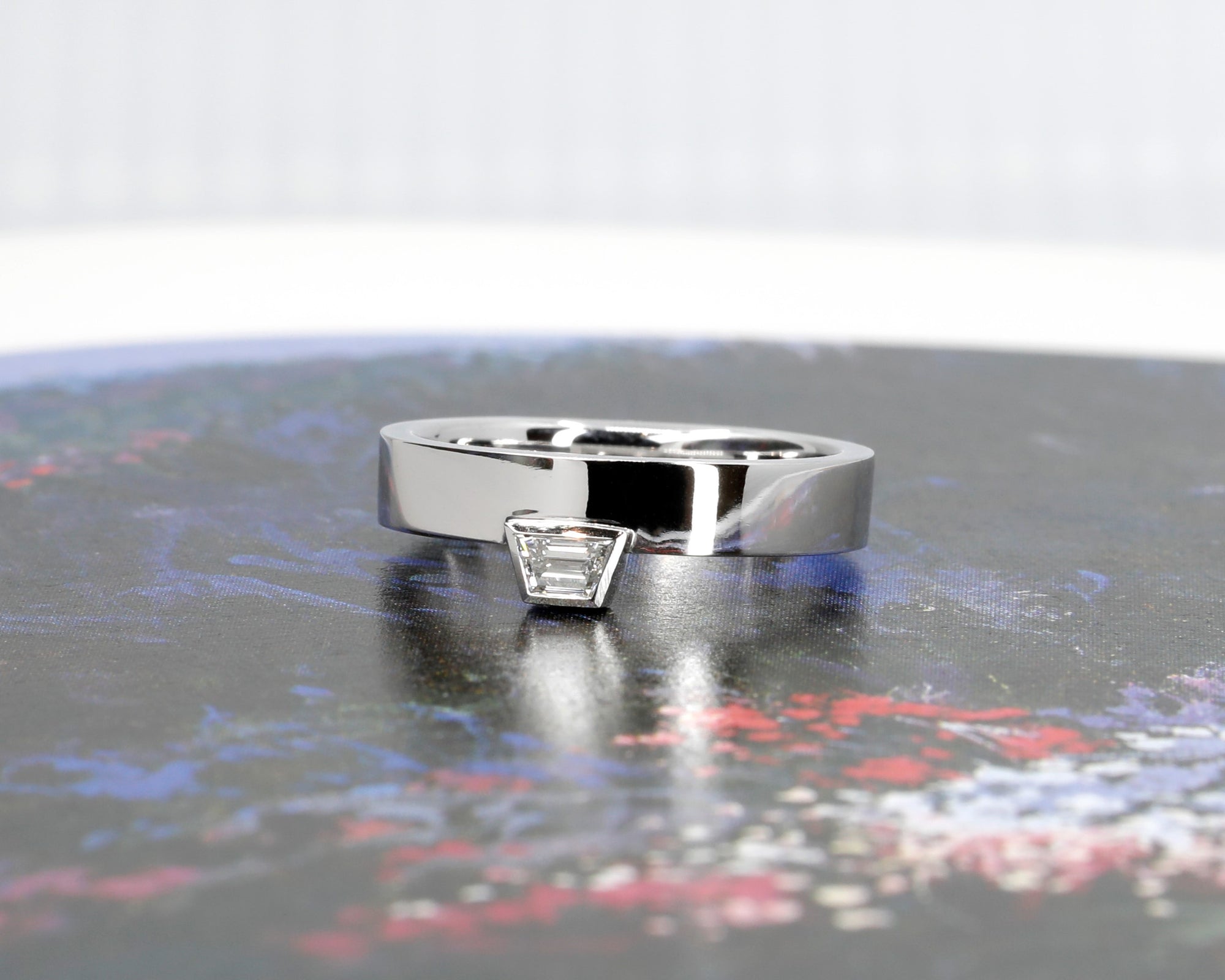 Close-up of Boxy Trapez Diamond Ring highlighting trapezoid diamond brilliance and sleek white gold craftsmanship, made in Montreal.