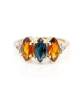 designer trilogy ring custom made in montreal with marquise shape sapphire and citrine natural gemstone made by bena jewelry design on white background