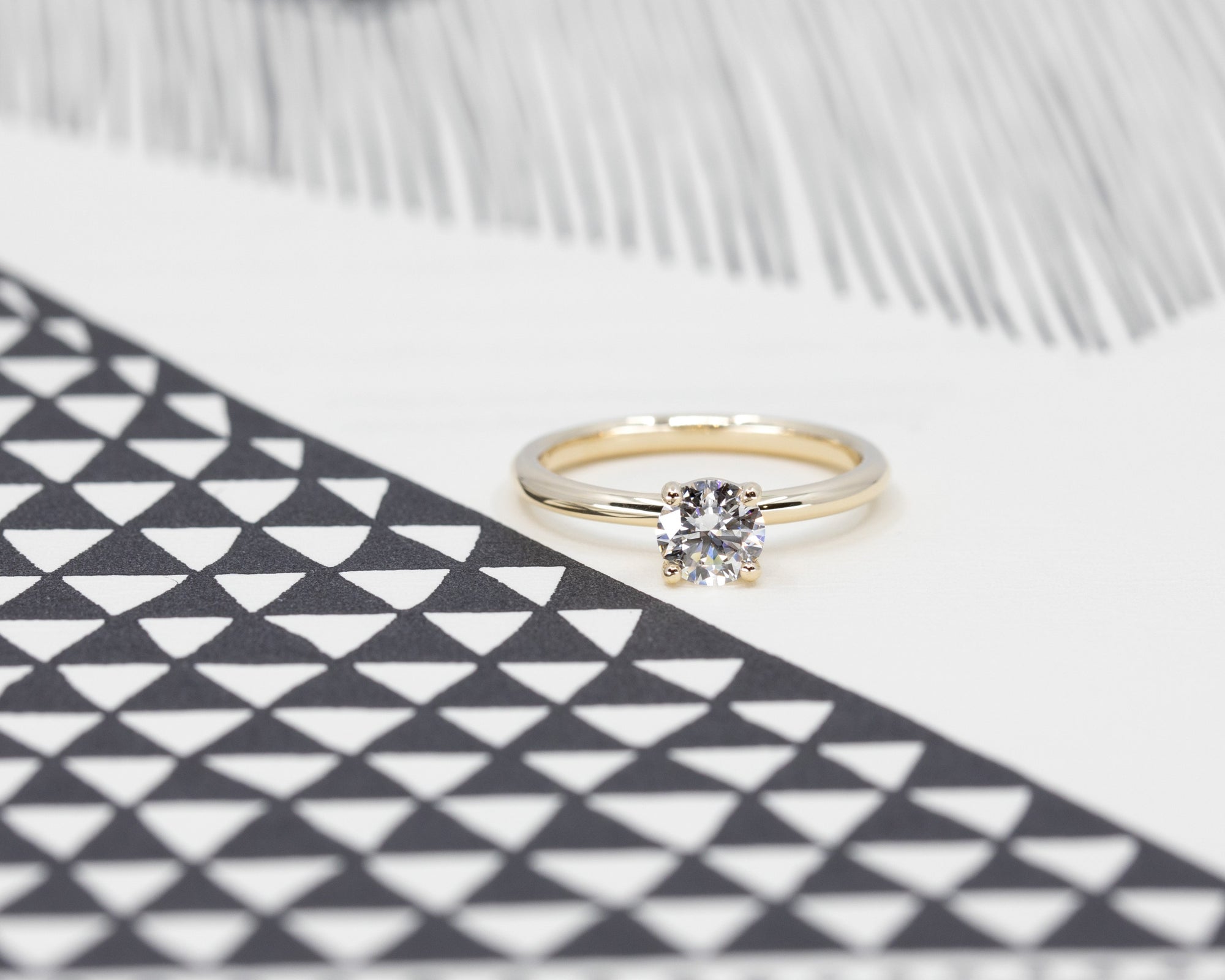 Front view of classic round yellow gold diamond engagement ring. Montreal made fine jewelry.