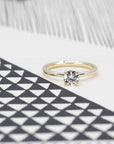Front view of classic round yellow gold diamond engagement ring. Montreal made fine jewelry.