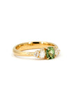 Side view of Cushion-cut green sapphire ring with lab-created pear diamonds in yellow gold. Designed and made in Montreal by Bena Jewelry, Canada.