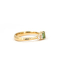 Cushion green sapphire center stone with pear-shaped lab diamonds on a yellow gold band. Crafted in Montreal by Canadian designer Bena Jewelry.