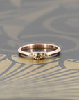 Champagne diamond engagement ring by Bena Jewelry, set on a rose gold band. Displayed on a dramatic dark background, emphasizing its modern yet timeless elegance. Handmade in Montreal, Canada.