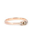 Champagne diamond engagement ring with golden hues by Bena Jewelry. This classic design includes sparkling side diamonds and a rose gold band. Photographed on a white background to highlight its elegance, made in Montreal.